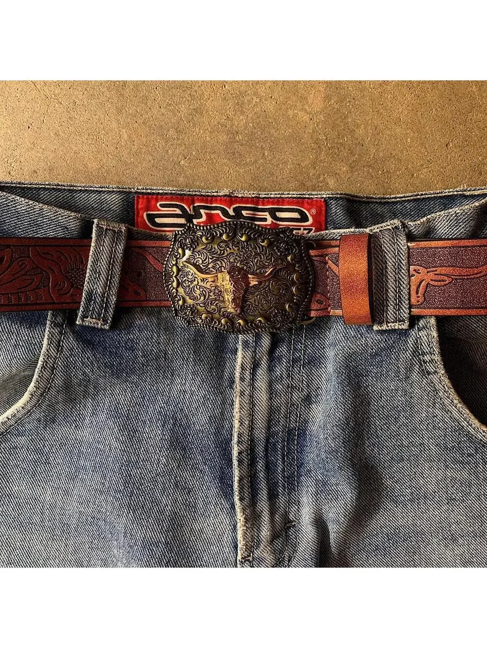 American Western Brown leather belt with silver-toned brass buckle, featuring a